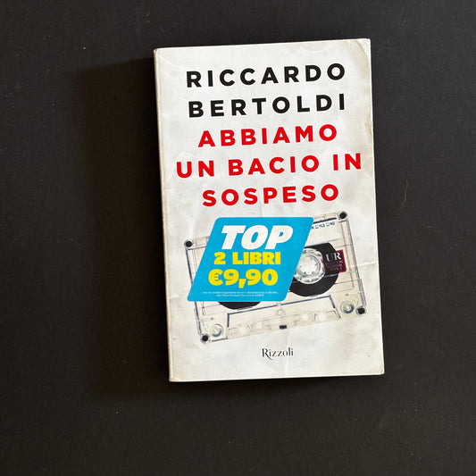 Abbiamo un bacio in sospeso (io e te)